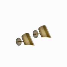 pair of brass wall lights against a white background