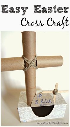 a cross made out of toilet paper and twine with the words easy easter cross craft