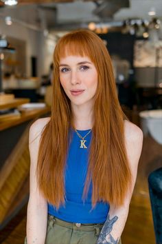 Woman with long, straight red hair and full bangs, wearing a blue top. Framing Bangs, Full Bangs, Face Framing Bangs, Soft Face, Long Hairstyle, Long Hairstyles, Modern Vibe