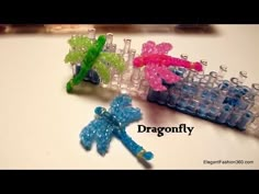 three small plastic dragonflys sitting next to each other