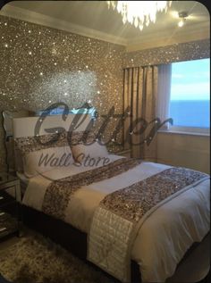 a large bed sitting in a bedroom next to a window with stars on the wall