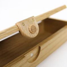 a close up of a wooden drawer with handles