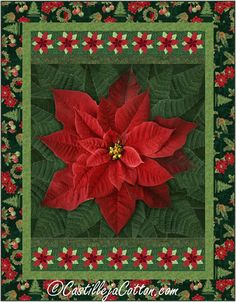 a red poinsettia sitting on top of a green and red quilted table cloth