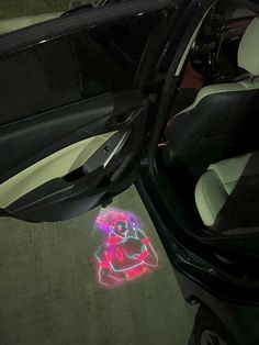 a car door is shown with an image of a person on the floor in front of it