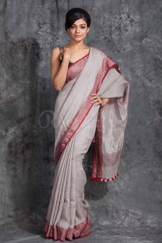 PRODUCT DETAILS Handloom Linen Saree Description: Pure Handloom Linen Saree Saree : Pure natural Linen Saree with wonderful homespun texture and feel Colour : As shown in the Picture Blouse  : Running fabric same as saree color Work : Handloom Fabric : Pure Linen Weight : 600 Grams Wash : Normal Wash Delivery Details : 7 - 10 Business days after dispach * Washing Instructions: Dry Clean Only * Occasions: Wedding Wear, Party Wear, Festive Wear, Durga Puja, Indian Wear, Sangeet Wear, Bridal Wear, Sari Party Wear, Lenin Sarees, Maroon Saree, Linen Sarees, Handloom Fabric, Model Pose, Jamdani Saree, Linen Saree, Party Kleidung