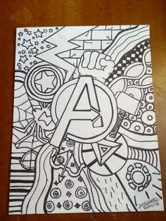 a drawing is shown on top of a piece of paper with the letter a in it