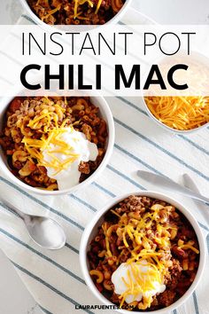 three bowls filled with chili and cheese on top of a white towel next to spoons