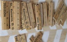 several rulers are arranged on top of each other to make the word measure look like it is made out of wood