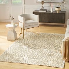 a living room with two chairs and a rug