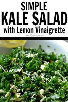 kale salad with lemon vinaigrete in a white bowl on a table