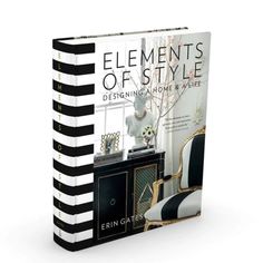 a book with black and white stripes on the cover, featuring an ornate chair in front of a window