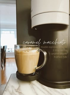 a cup of coffee sitting on top of a counter