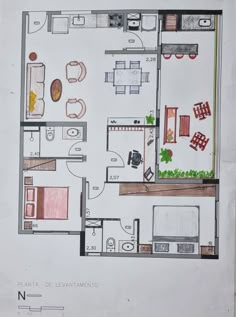 a drawing of a floor plan with furniture and kitchen areas in it, including the living room