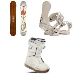 three snowboard boots, one white and one brown with flowers on the soles