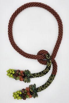 Bead & Stone Necklace - With the rich and earthy tones of matte brick and olive greens, this rope necklace is crocheted from hundreds of glass seed beads and ends in two clusters of greens, rust, and chartreuse teardrop, leaf and dagger glass beads.  Easy-to-wear; great for autumn; great for any season! Crochet Snakes, Beading Inspiration, Bead Crochet Rope, Crochet Rope, Stone Beaded Necklace, Artful Home, Cluster Necklace, Rope Necklace, Glass Seed Beads