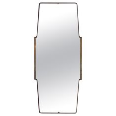 a mirror that is sitting on top of a table with a metal frame around it