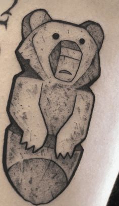 a drawing of a bear on the back of a man's arm