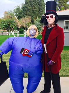 two people in costumes standing next to each other