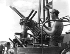 an old photo of a man working on machinery