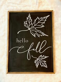 a black and white sign that says hello fall