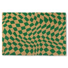 a green and beige door mat with an abstract design