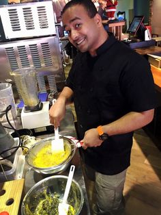 a man is making food in a kitchen