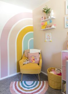 a child's room decorated in pastel colors