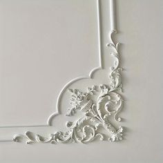 an ornate white frame on the wall