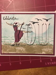 a card with an image of a woman dancing on the beach and birds flying around her