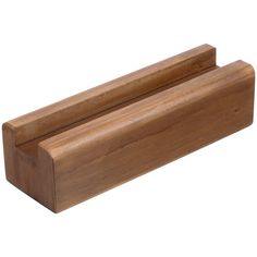 a wooden shelf with two pieces of wood sticking out of it's sides on a white background