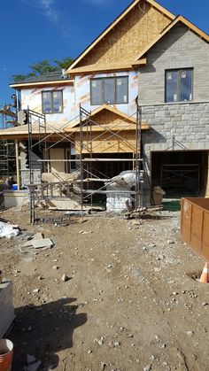 a house under construction with scaffolding around it