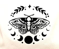 a black and white drawing of a moth on a white background with crescents, stars and leaves