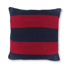 a red and black striped pillow on a white background