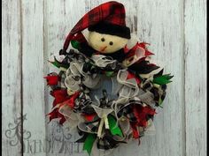 a christmas wreath with a snowman on it