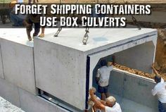 two men are working on the side of a container that is being built into concrete