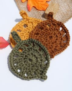 These coasters are perfect for your favorite warm beverages like tea, hot apple cider, and hot cocoa! Yellow coasters are slightly larger to accommodate larger mugs. Just be sure to avoid excessive heat! Crochet Leaf Coasters, Fall Leaf Coasters Crochet, Crochet Fall Coasters, Maple Leaf Coaster Crochet, Pumpkin Crochet Coaster, Apple Crochet Coaster, Leaf Coasters, Crochet Leaf, Hot Apple Cider