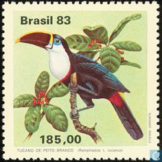 a postage stamp with a bird on it's side and leaves in the background