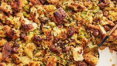 a casserole dish filled with stuffing and vegetables