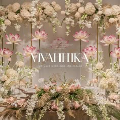 a display with flowers and branches in front of the words, mahika make wedding and dreams