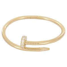 Brand Cartier Style Nail Material 18K Yellow Gold with Diamonds Brilliant cut Diamonds totaling 0.58ct Diamond estimated quality: EF/VS Bracelet Size 15 Bracelet Weight 28.8gr Bracelet width 3.5mm Mint Condition Like, new Comes with Cartier Bracelet Box Retail Price $13,300 Cartier Gold Jewelry With Pave Setting, Cartier Nail Bracelet, Cartier Diamond, Cartier Gold, Nail Bracelet, Cartier Bracelet, Bracelet Box, Diamond Bangles Bracelet, Cartier Jewelry