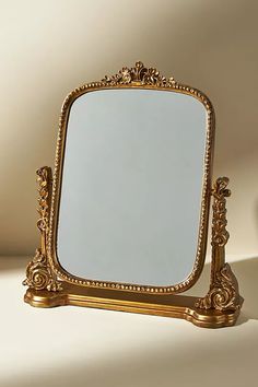 a mirror sitting on top of a white table