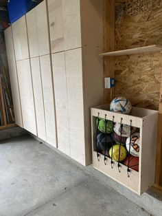 a storage area with soccer balls in it