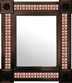 a decorative mirror with an intricate design on it