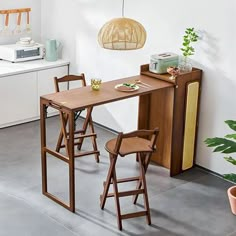 a kitchen with white walls and wooden furniture