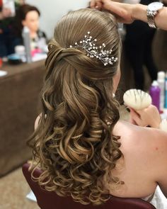 a woman getting her hair done at a salon