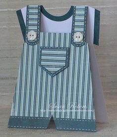 an origami card with overalls and buttons on it