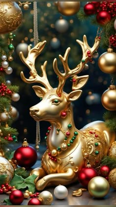 a golden reindeer sitting in front of christmas decorations