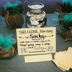 there is a sign that says take a guess how many socks are in the jar