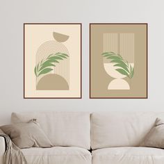 two framed art prints on the wall above a couch in a living room with a white sofa