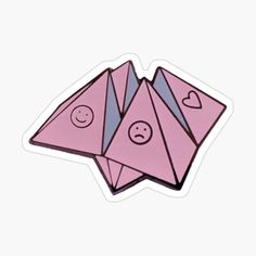 two pink origami pieces with faces and hearts on them, one in the middle